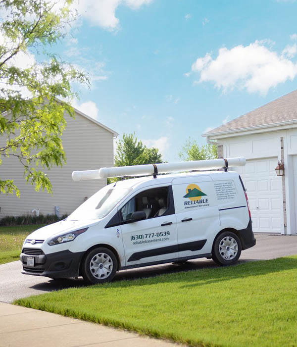 Reliable Basement Services service van in driveway